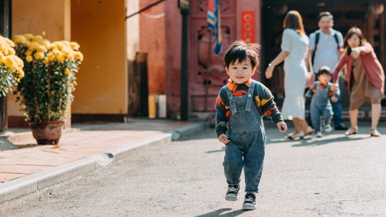 A child walks away from his family, who are concerned about his elopement